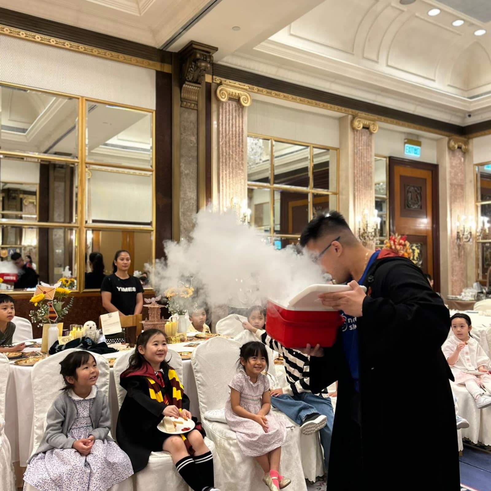 Newtonshow host creating a huge cloud of dry-ice fog at a wizard-themed birthday party