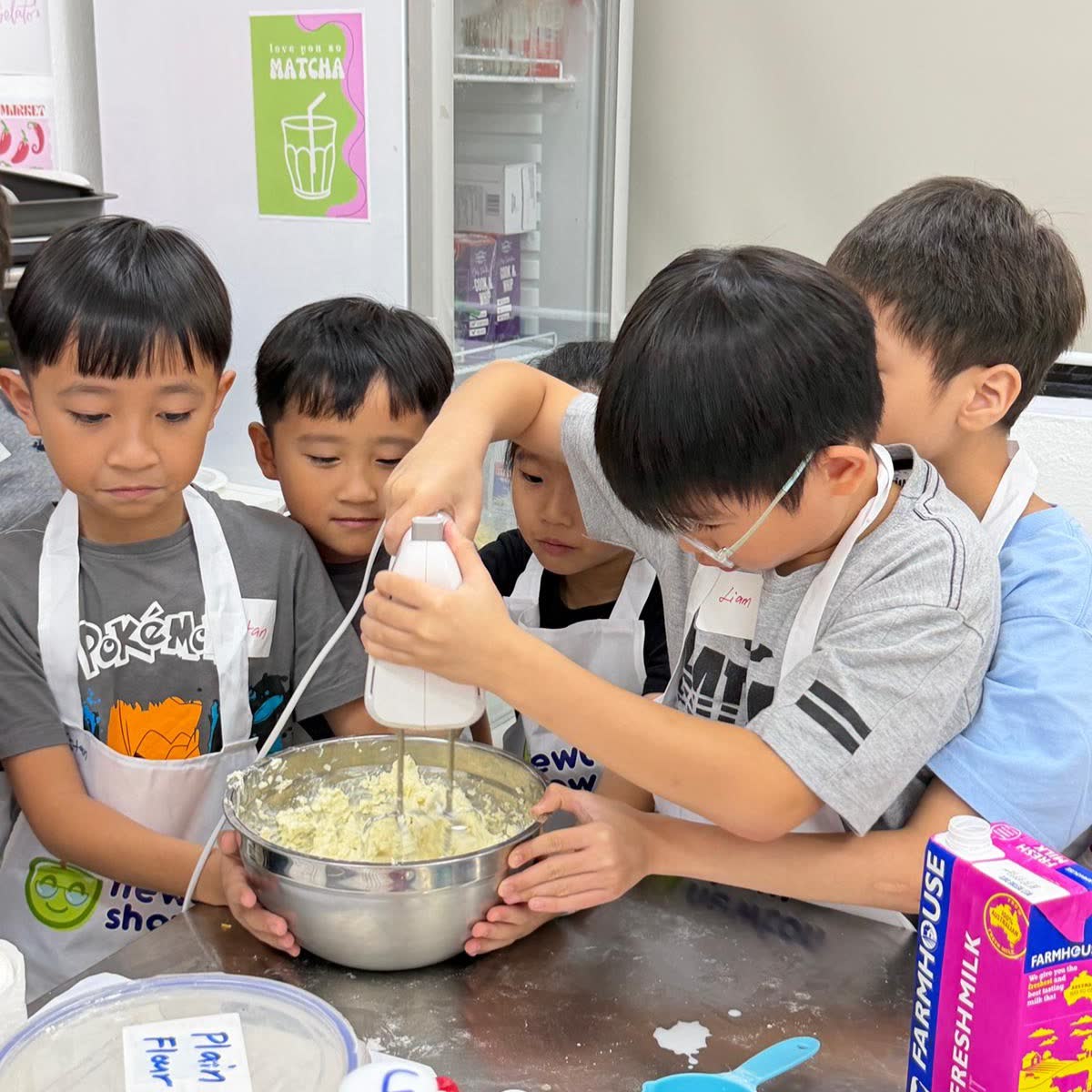 Boys working together on a cooking-science experiment at Newtonshow
