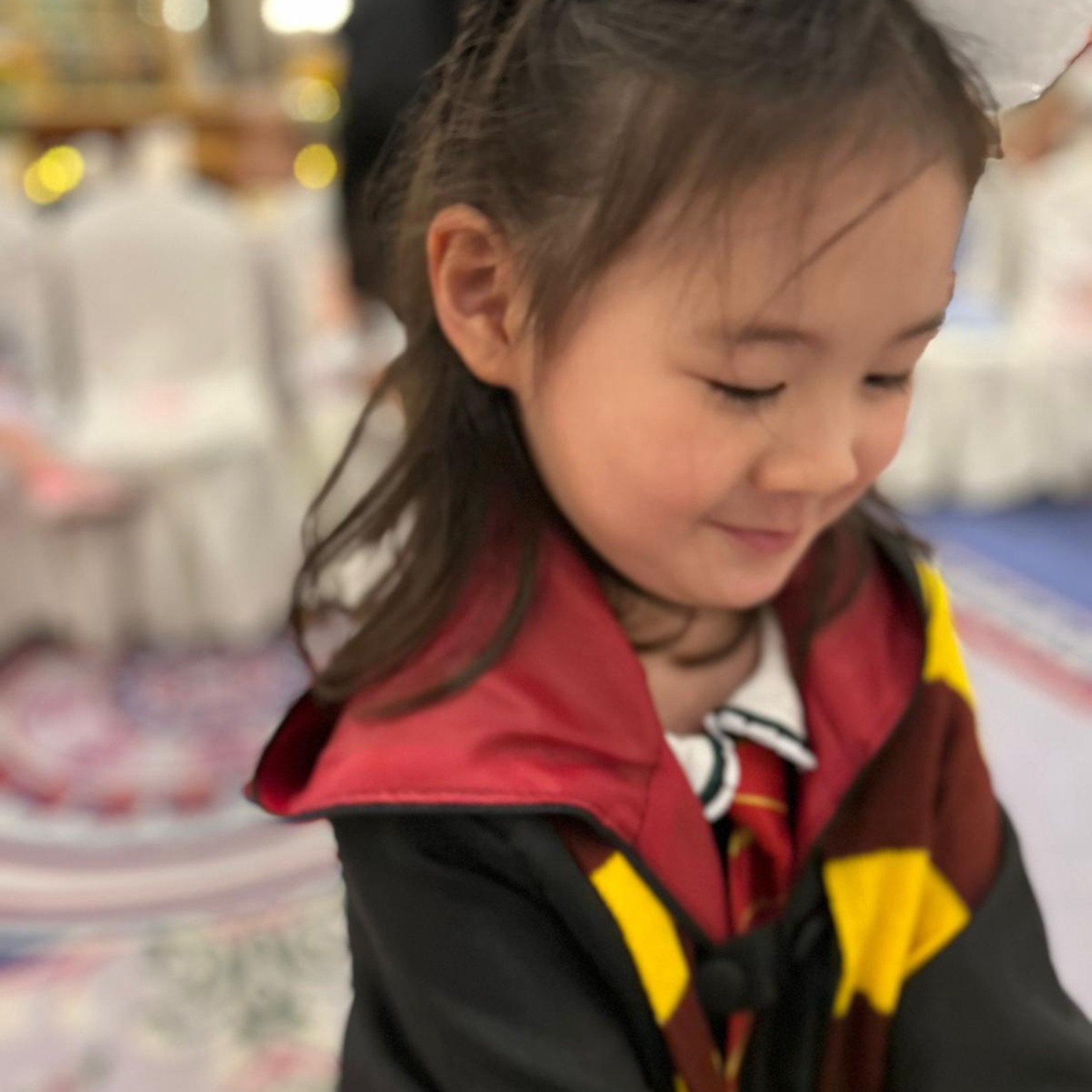 Young guest in a wizard robe at a Newtonshow birthday party
